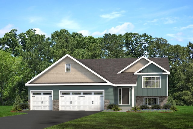 view of front of home featuring a front lawn and a garage