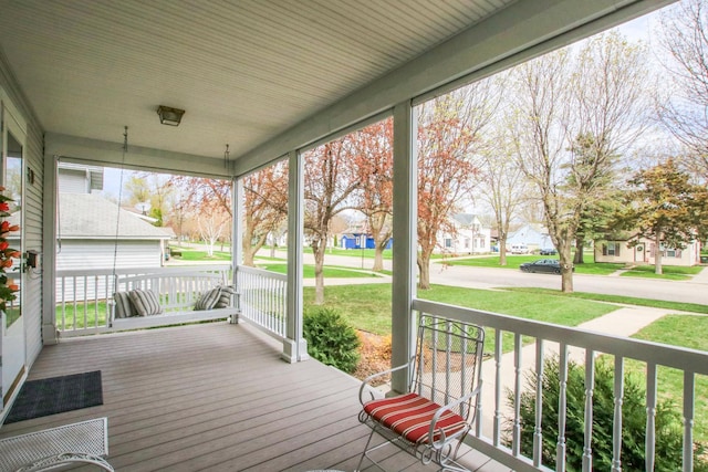 wooden deck with a yard and a porch