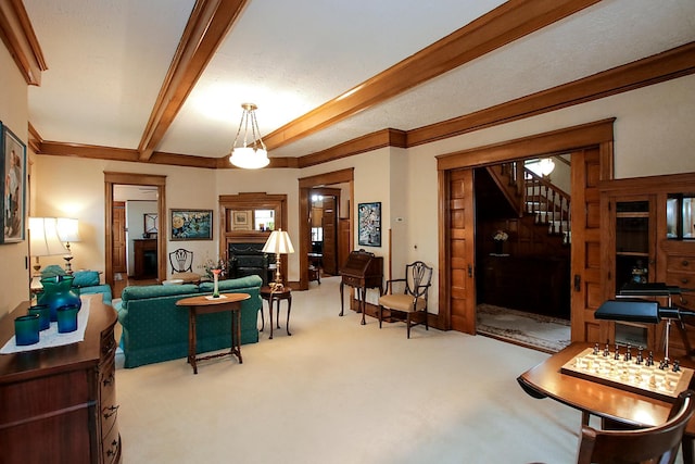 carpeted living room featuring a notable chandelier, a textured ceiling, beam ceiling, and crown molding