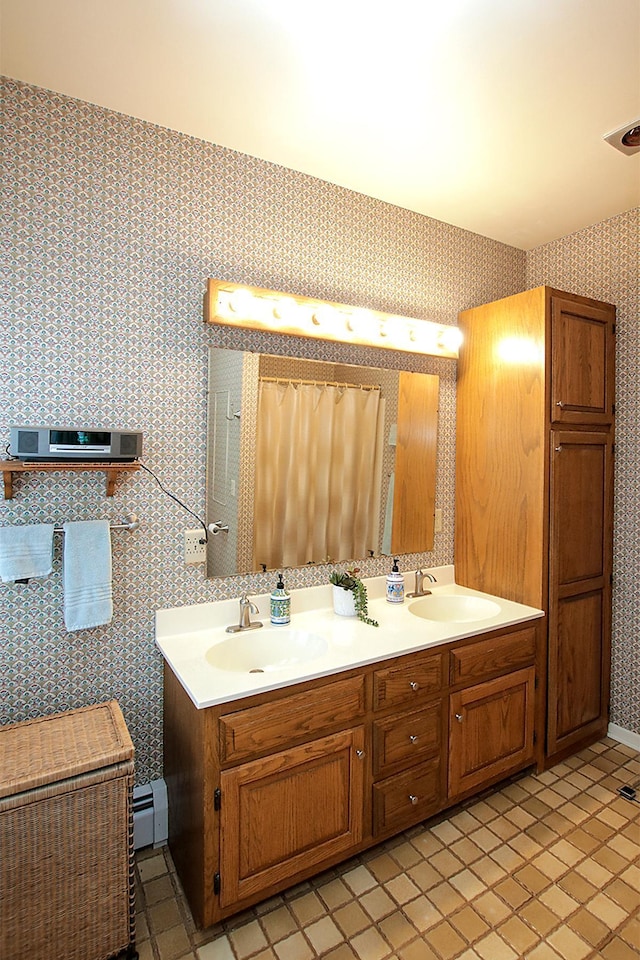 bathroom featuring vanity, a baseboard radiator, and tile patterned flooring