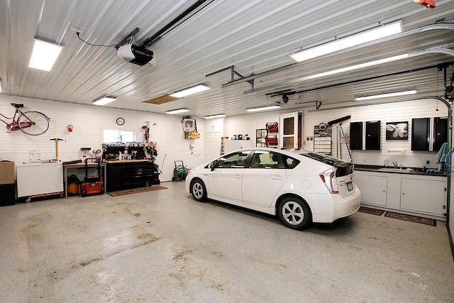 garage featuring a workshop area and a garage door opener