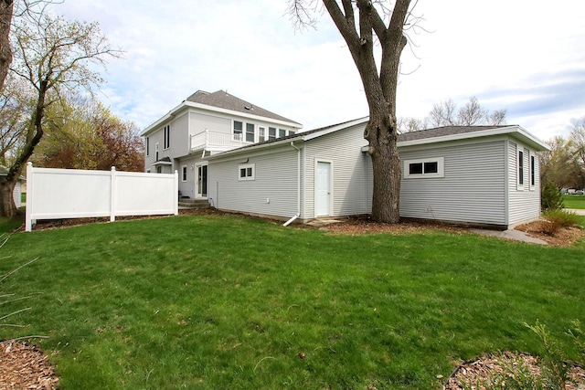 rear view of house with a lawn