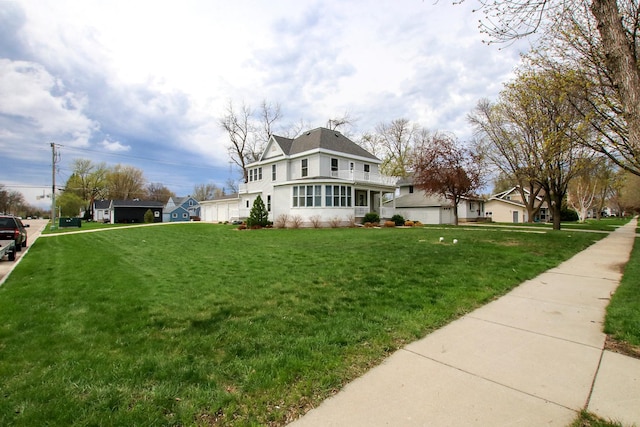 exterior space with a front yard and a garage