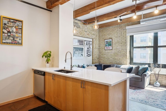 kitchen featuring stainless steel dishwasher, brick wall, sink, and kitchen peninsula