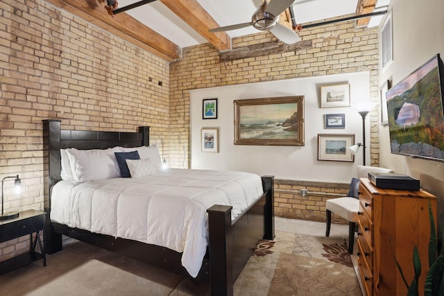 bedroom with ceiling fan, brick wall, and beamed ceiling