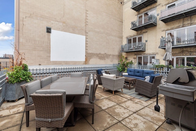 view of patio / terrace featuring outdoor lounge area and a balcony