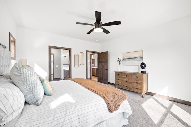 bedroom with ensuite bath, light carpet, and ceiling fan