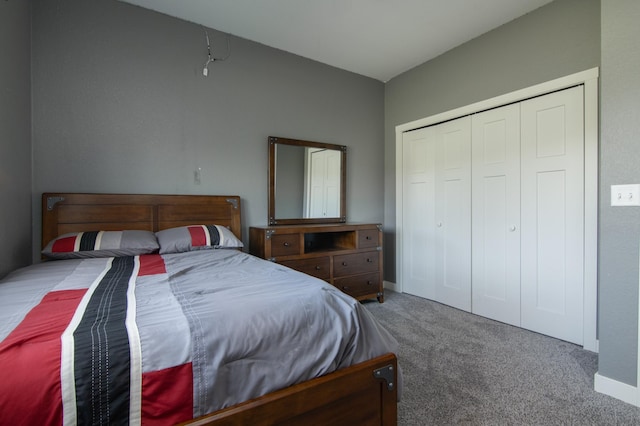 carpeted bedroom featuring a closet