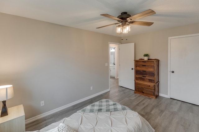 bedroom with ceiling fan and light hardwood / wood-style floors