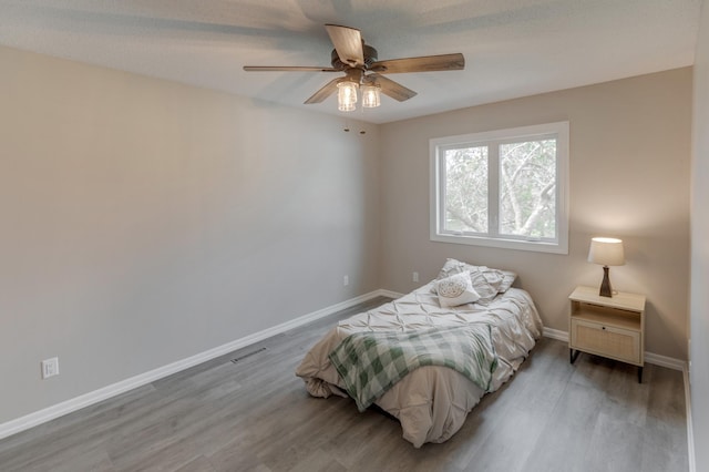 bedroom featuring ceiling fan and light hardwood / wood-style flooring