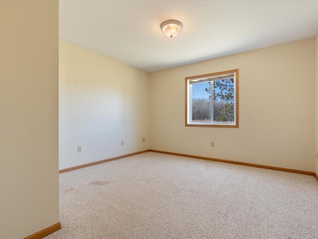 unfurnished room with carpet