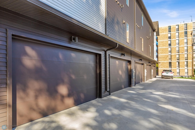 garage featuring wood walls