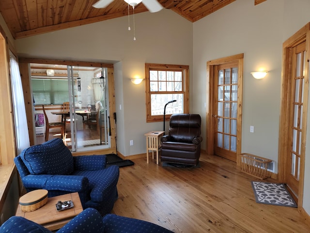 living room featuring wood-type flooring, high vaulted ceiling, wood ceiling, and ceiling fan