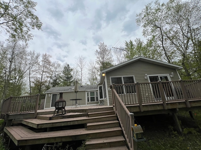 rear view of house with a deck