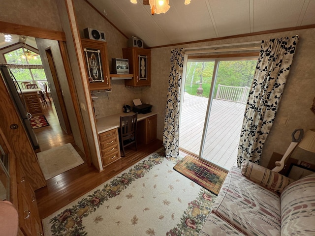 living room featuring vaulted ceiling and hardwood / wood-style floors