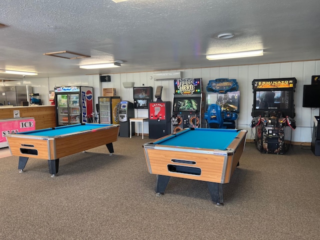 rec room featuring a textured ceiling, carpet flooring, billiards, and an AC wall unit