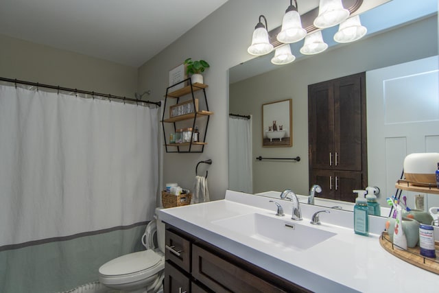 full bathroom featuring vanity, a notable chandelier, and toilet
