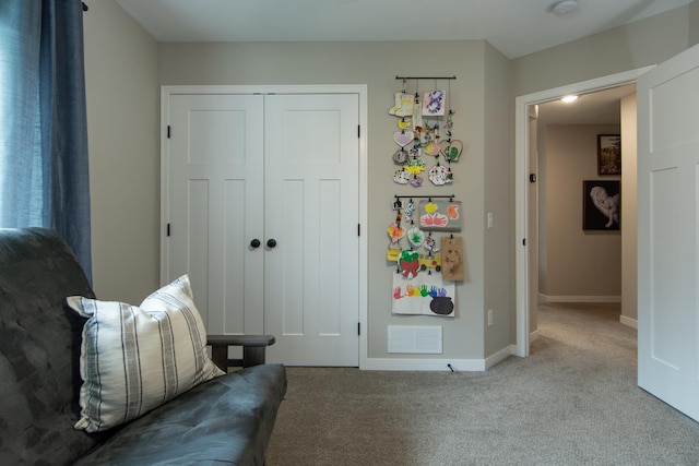living area with carpet flooring, baseboards, and visible vents