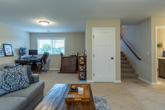 living room featuring stairway, baseboards, and carpet flooring
