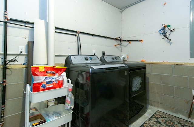 clothes washing area with washer and dryer