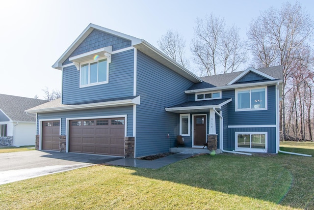 craftsman-style house featuring a garage, stone siding, a front yard, and concrete driveway