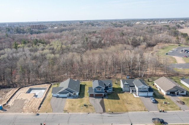aerial view with a residential view and a wooded view