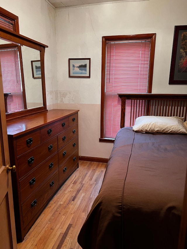 bedroom with light hardwood / wood-style flooring