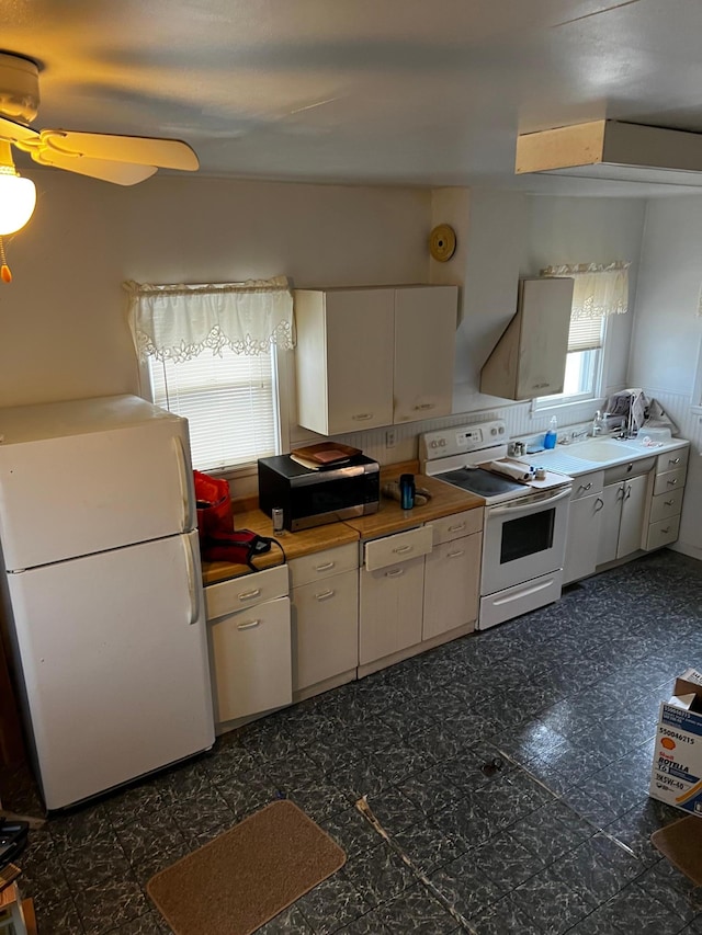 kitchen with white cabinetry, white appliances, and ceiling fan