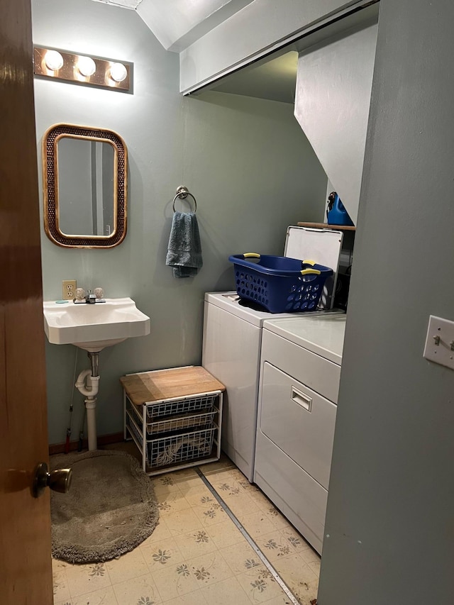 bathroom with washing machine and dryer and lofted ceiling