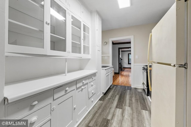 corridor with hardwood / wood-style floors