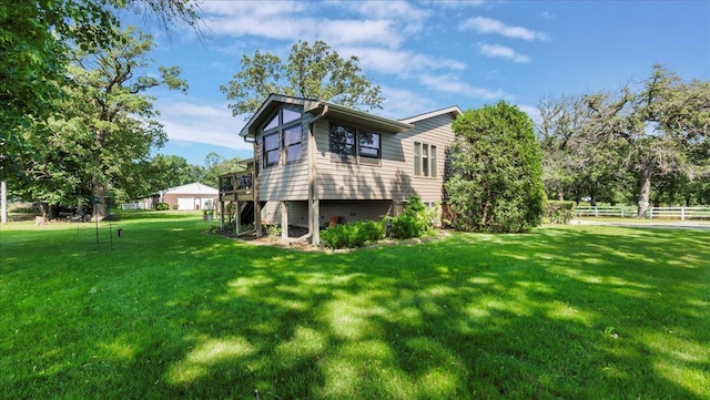 view of side of property featuring a lawn