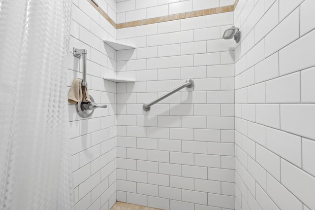 bathroom with a tile shower