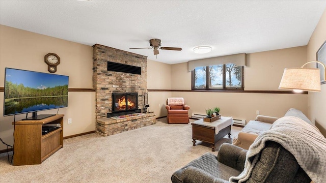 living room featuring a fireplace, a baseboard radiator, light colored carpet, and a textured ceiling