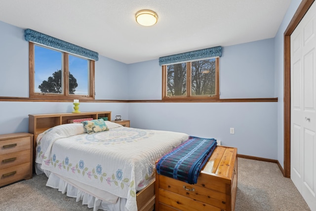 carpeted bedroom featuring a closet