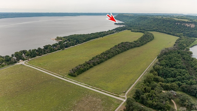 drone / aerial view featuring a water view and a rural view