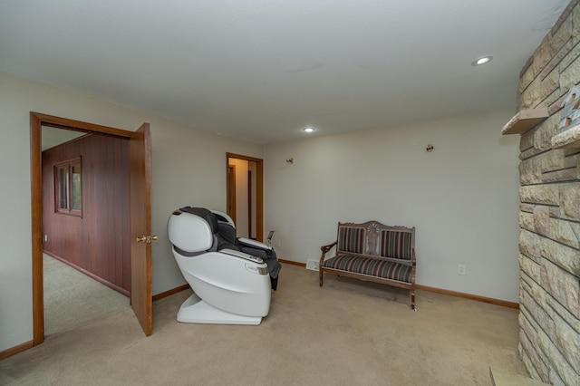 living area with baseboards, recessed lighting, and light colored carpet