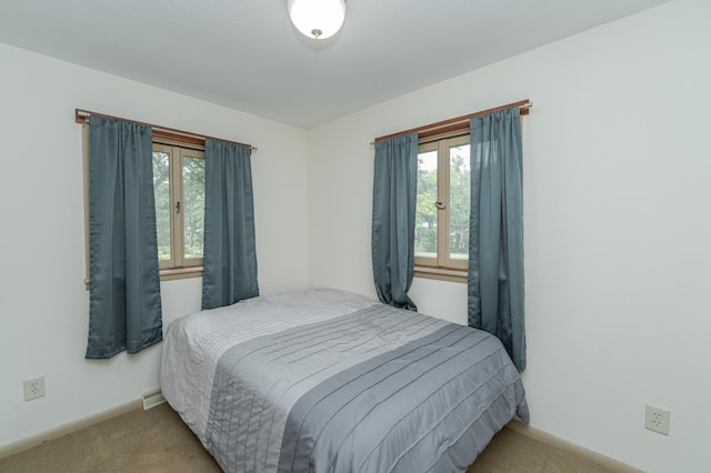 bedroom with multiple windows, baseboards, french doors, and light colored carpet