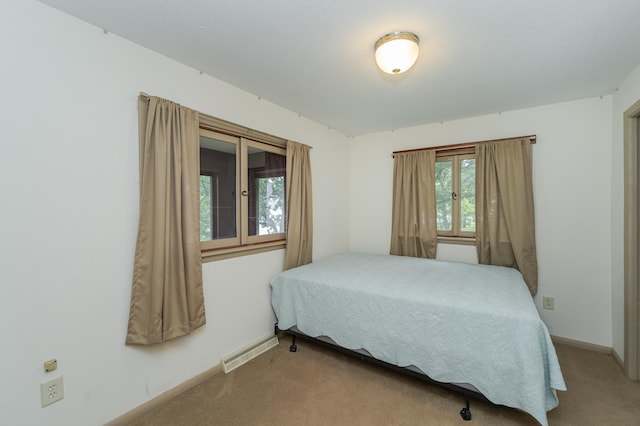 bedroom with light carpet, baseboards, and visible vents