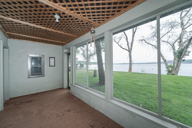 unfurnished sunroom with a water view and plenty of natural light