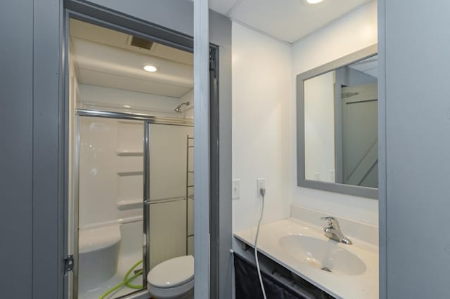 full bathroom with vanity, toilet, and an enclosed shower