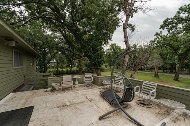 view of patio with a fire pit