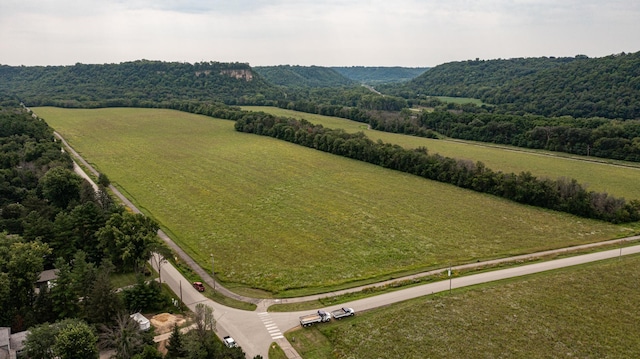 bird's eye view with a rural view and a view of trees