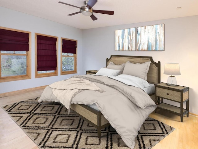 bedroom with hardwood / wood-style flooring and ceiling fan