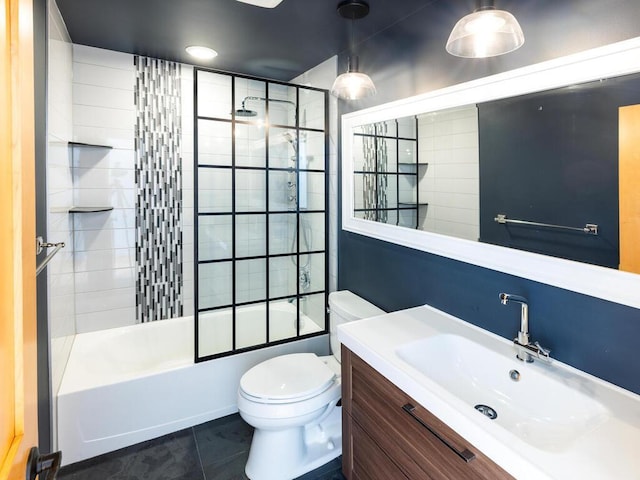 full bathroom with tiled shower / bath combo, vanity, tile patterned floors, and toilet