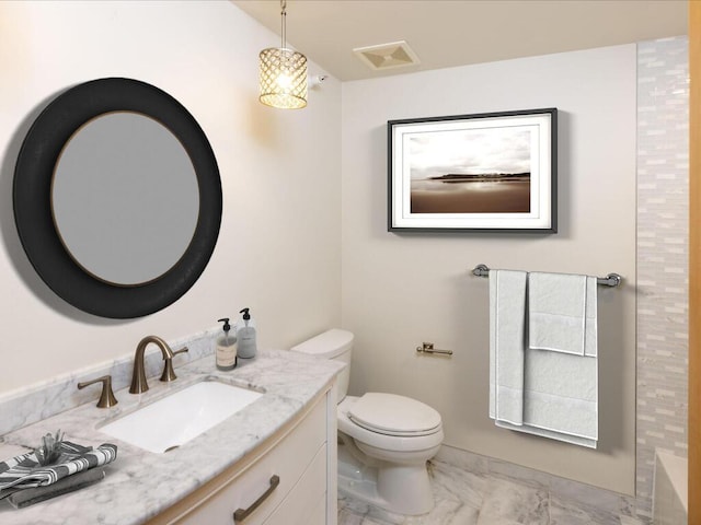 bathroom with vanity and toilet