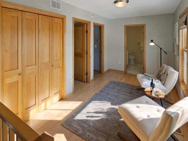 sitting room with light hardwood / wood-style floors