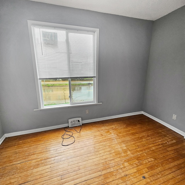 unfurnished room featuring light hardwood / wood-style floors