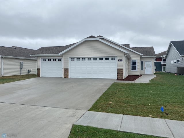 single story home featuring a front yard, a garage, and central AC