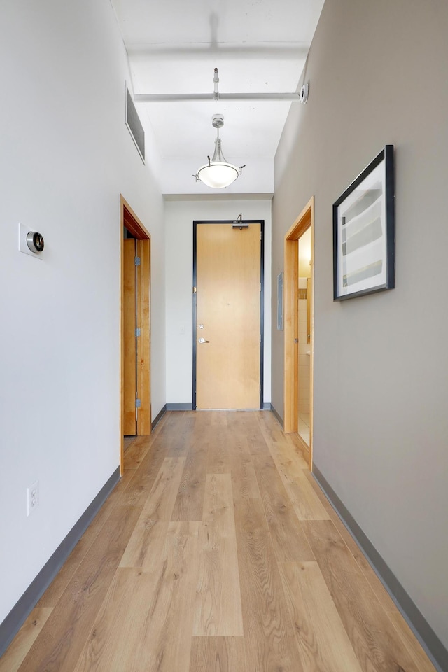 hall with light hardwood / wood-style flooring