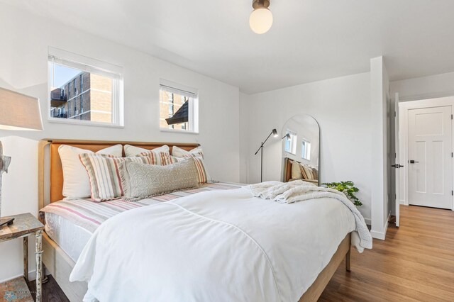 bedroom with wood-type flooring